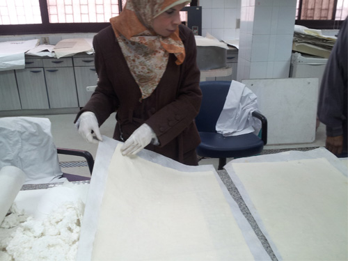 Book restoration at Dar al-Kotob: Conservators drying books